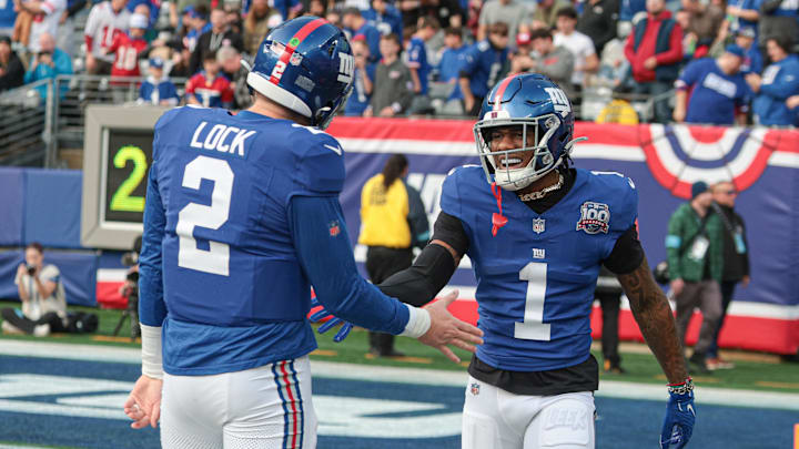 New York Giants wide receiver Malik Nabers celebrates with quarterback Drew Lock after a touchdown reception.