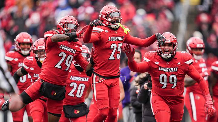 Louisville Cardinals defensive back Tayon Holloway (25) celebrates with his teammates after his interception against Kentucky in the second half Saturday, November 29, 2025 in Louisville, Kentucky at L&N Federal Credit Union Stadium. The Cards were rolling 27-0 through the fourth quarter. Louisville Cardinals defensive back Tayon Holloway (25) celebrates with his teammates after his interception against Kentucky in the second half Saturday, November 29, 2025 in Louisville, Kentucky at L&N Federal Credit Union Stadium. The Cards were rolling 27-0 through the fourth quarter.