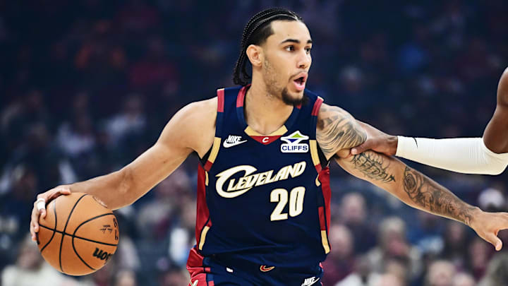 Dec 6, 2025; Cleveland, Ohio, USA; Cleveland Cavaliers guard Jaylon Tyson (20) brings the ball up court against Golden State Warriors guard Buddy Hield (7) during the first half at Rocket Arena. Mandatory Credit: Ken Blaze-Imagn Images Dec 6, 2025; Cleveland, Ohio, USA; Cleveland Cavaliers guard Jaylon Tyson (20) brings the ball up court against Golden State Warriors guard Buddy Hield (7) during the first half at Rocket Arena. Mandatory Credit: Ken Blaze-Imagn Images