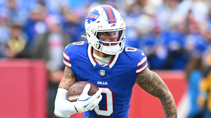 Dec 29, 2024; Orchard Park, New York, USA; Buffalo Bills wide receiver Keon Coleman (0) carries the ball after making a catch in the second quarter against the New York Jets at Highmark Stadium. Mandatory Credit: Mark Konezny-Imagn Images