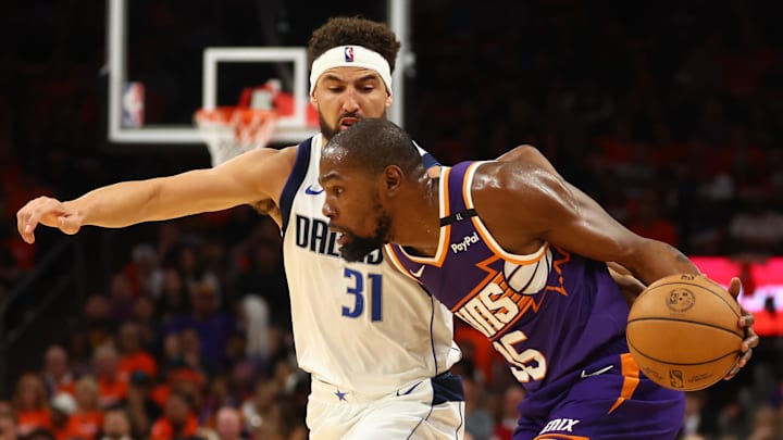 Oct 26, 2024; Phoenix, Arizona, USA; Phoenix Suns forward Kevin Durant (35) against Dallas Mavericks guard Klay Thompson (31) in the first half of the home opener at Footprint Center. Mandatory Credit: Mark J. Rebilas-Imagn Images