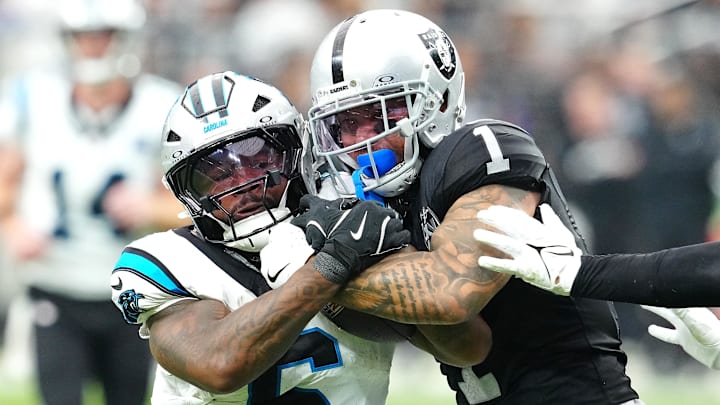 Sep 22, 2024; Paradise, Nevada, USA; Las Vegas Raiders safety Marcus Epps (1) tackles Carolina Panthers running back Miles Sanders (6) during the third quarter at Allegiant Stadium. Mandatory Credit: Stephen R. Sylvanie-Imagn Images Sep 22, 2024; Paradise, Nevada, USA; Las Vegas Raiders safety Marcus Epps (1) tackles Carolina Panthers running back Miles Sanders (6) during the third quarter at Allegiant Stadium. Mandatory Credit: Stephen R. Sylvanie-Imagn Images