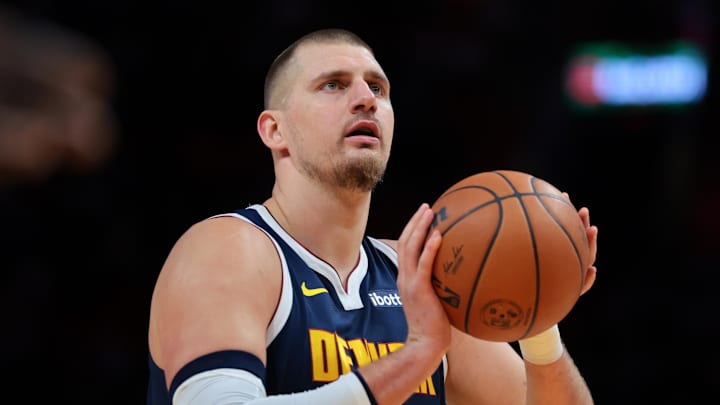 Dec 29, 2025; Miami, Florida, USA; Denver Nuggets center Nikola Jokic (15) shoots a free throw against the Miami Heat during the first quarter at Kaseya Center.