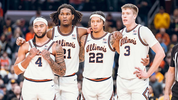 Illinois players Kylan Boswell (4), Morez Johnson Jr. (21), Tre White (22) and Ben Humrichous (3) gather during the Illini's 80-77 win against Missouri on Sunday at the Enterprise Center in St. Louis. Illinois players Kylan Boswell (4), Morez Johnson Jr. (21), Tre White (22) and Ben Humrichous (3) gather during the Illini's 80-77 win against Missouri on Sunday at the Enterprise Center in St. Louis.