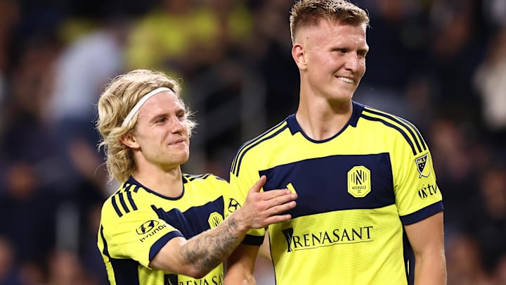 Nashville SC forward Sam Surridge (9) and midfielder Edvard Tagseth celebrate a goal from a penalty kick in the first half against Chicago Fire at Geodis Park. Mandatory Credit: Casey Gower-Imagn Images