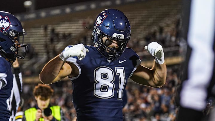 Nov 1, 2024; East Hartford, Connecticut, USA; Connecticut Huskies tight end Louis Hansen (81) reacts after running the ball for a touchdown against the Georgia State Panthers in the first quarter at Rentschler Field at Pratt & Whitney Stadium. Mandatory Credit: David Butler II-Imagn Images