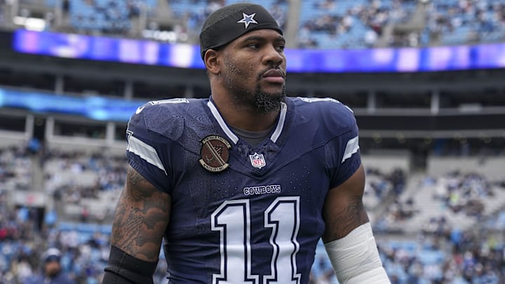 Dec 15, 2024; Charlotte, North Carolina, USA; Dallas Cowboys linebacker Micah Parsons (11) walks onto the field during the first quarter against the Carolina Panthers at Bank of America Stadium. Mandatory Credit: Jim Dedmon-Imagn Images