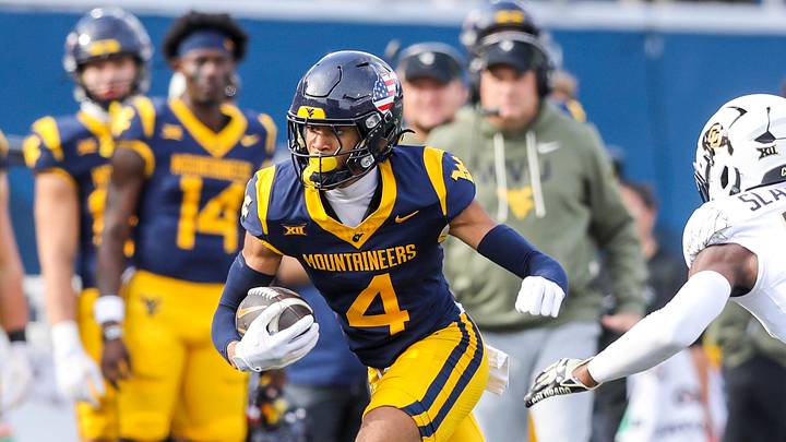 Nov 8, 2025; Morgantown, West Virginia, USA; West Virginia Mountaineers wide receiver Cam Vaughn (4) makes a catch and runs for extra yards during the third quarter against the Colorado Buffaloes at Milan Puskar Stadium. Mandatory Credit: Ben Queen-Imagn Images Nov 8, 2025; Morgantown, West Virginia, USA; West Virginia Mountaineers wide receiver Cam Vaughn (4) makes a catch and runs for extra yards during the third quarter against the Colorado Buffaloes at Milan Puskar Stadium. Mandatory Credit: Ben Queen-Imagn Images