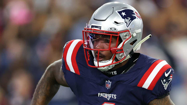  New England Patriots receiver Ja'Lynn Polk (1) runs the ball during the first half against the Washington Commanders at Gillette Stadium.