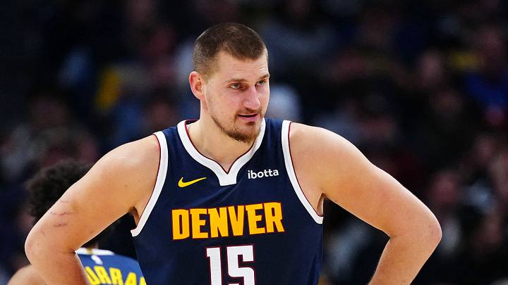 Dec 15, 2025; Denver, Colorado, USA; Denver Nuggets center Nikola Jokic (15) reacts in the second quarter against the Houston Rockets at Ball Arena. Mandatory Credit: Ron Chenoy-Imagn Images
