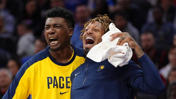 Mar 14, 2025; Philadelphia, Pennsylvania, USA; Indiana Pacers forward James Johnson (16) reacts with center Thomas Bryant (3) against the Philadelphia 76ers in the fourth quarter at Wells Fargo Center. Mandatory Credit: Kyle Ross-Imagn Images