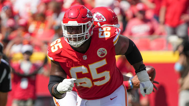 Aug 17, 2024; Kansas City, Missouri, USA; Kansas City Chiefs guard Trey Smith (65) prepares to block against the Detroit Lions during the game at GEHA Field at Arrowhead Stadium. Mandatory Credit: Denny Medley-Imagn Images