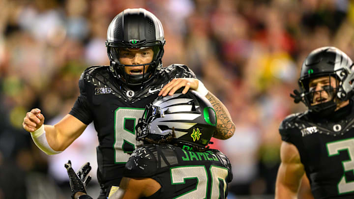 Oct 12, 2024; Eugene, Oregon, USA; Oregon Ducks quarterback Dillon Gabriel (8) celebrates a touchdown run during the second half against the Ohio State Buckeyes at Autzen Stadium.