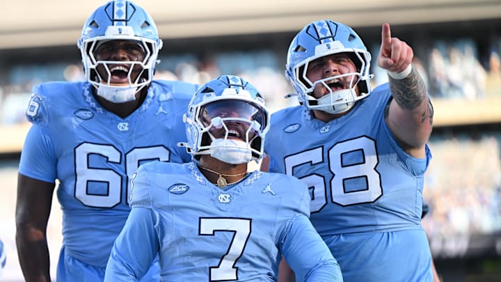Nov 22, 2025; Chapel Hill, North Carolina, USA; North Carolina Tar Heels quarterback Gio Lopez (7) celebrates after scoring a touchdown during the first half against Duke Blue Devils at Kenan Stadium. Mandatory Credit: William Howard-Imagn Images