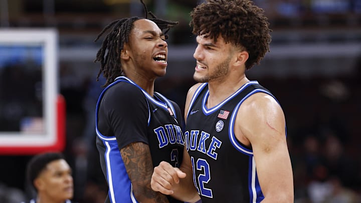 Nov 27, 2025; Chicago, Illinois, USA; Duke Blue Devils forward Cameron Boozer (12) celebrates with guard Isaiah Evans (3) during the second half at United Center. Mandatory Credit: Kamil Krzaczynski-Imagn Images