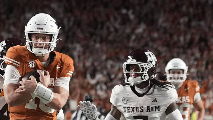 Texas Longhorns quarterback Arch Manning keeps the ball and runs for a touchdown during the second half against the Texas A&M Aggies at Darrell K Royal-Texas Memorial Stadium. 