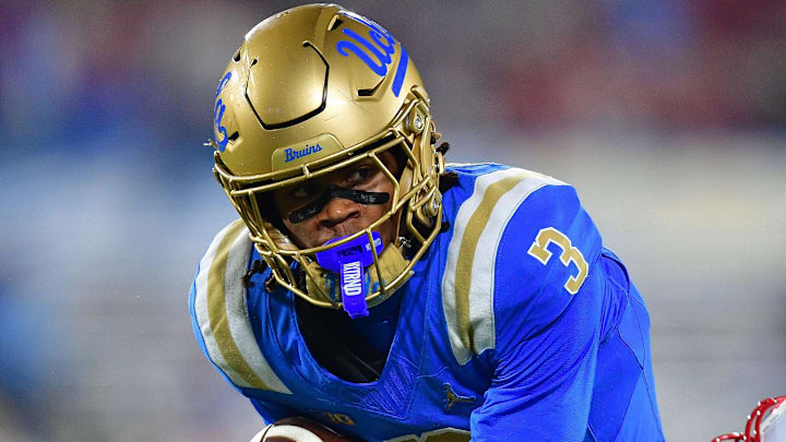Nov 8, 2025; Pasadena, California, USA; UCLA Bruins wide receiver Kwazi Gilmer (3) runs the ball ahead of Nebraska Cornhuskers defensive back Donovan Jones (37) during the first half at the Rose Bowl. Mandatory Credit: Gary A. Vasquez-Imagn Images