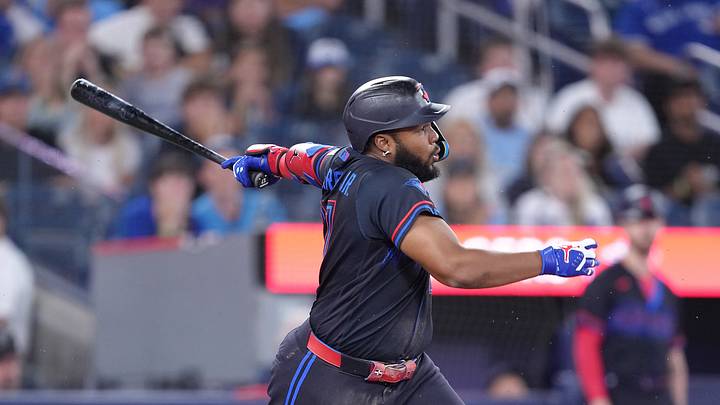 Sep 11, 2026; Toronto, Ontario, CAN;  Toronto Blue Jays first baseman Vladimir Guerrero Jr. (27) gets an infield hit against the Baltimore Orioles during the ninth inning at Rogers Centre.  Mandatory Credit: Nick Turchiaro-Imagn Images