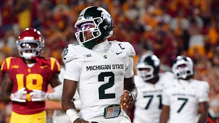 Sep 20, 2025; Los Angeles, California, USA; Michigan State Spartans quarterback Aidan Chiles (2) scores a touchdown against the Southern California Trojans during the second half at the Los Angeles Memorial Coliseum. Mandatory Credit: Gary A. Vasquez-Imagn Images