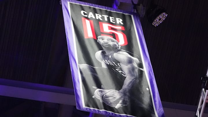 Nov 2, 2024; Toronto, Ontario, CAN; The banner indicating the retirement of the jersey of Toronto Raptors player Vince Carter is raised to the roof at halftime of a game against the Sacramento Kings at Scotiabank Arena. Mandatory Credit: John E. Sokolowski-Imagn Images