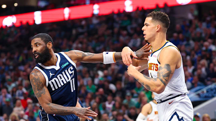 Mar 17, 2024; Dallas, Texas, USA; Denver Nuggets forward Michael Porter Jr. (1) and Dallas Mavericks guard Kyrie Irving (11) go for the ball during the first quarter at American Airlines Center. Mandatory Credit: Kevin Jairaj-Imagn Images Mar 17, 2024; Dallas, Texas, USA; Denver Nuggets forward Michael Porter Jr. (1) and Dallas Mavericks guard Kyrie Irving (11) go for the ball during the first quarter at American Airlines Center. Mandatory Credit: Kevin Jairaj-Imagn Images