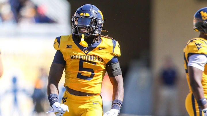 Aug 30, 2025; Morgantown, West Virginia, USA; West Virginia Mountaineers safety Fred Perry (5) celebrates after a tackle for loss during the second quarter against the Robert Morris Colonials at Milan Puskar Stadium. Mandatory Credit: Ben Queen-Imagn Images