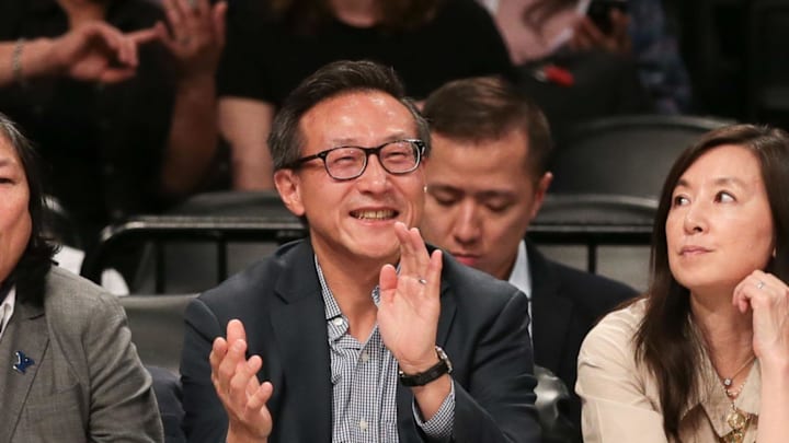 May 9, 2019; New York City, NY, USA; Taiwanese businessman Joe Tsai (center) cheers during the second half of the preseason WNBA game between the New York Liberty and the China National Team at Barclays Center. Mandatory Credit: Vincent Carchietta-Imagn Images
