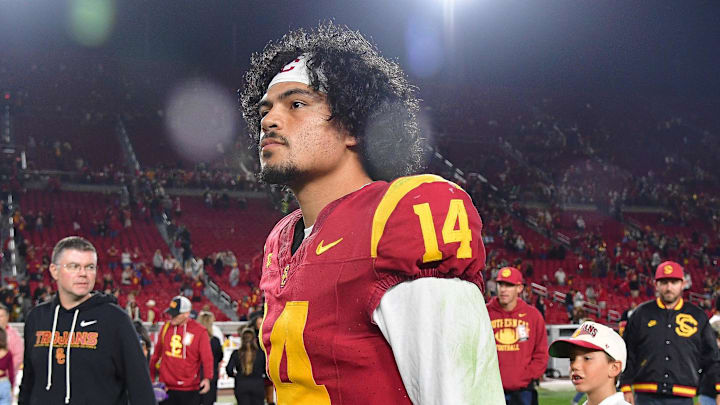 Nov 7, 2025; Los Angeles, California, USA; Southern California Trojans quarterback Jayden Maiava (14) leaves the field following the victory against the Northwestern Wildcats at the Los Angeles Memorial Coliseum. Mandatory Credit: Gary A. Vasquez-Imagn Images
