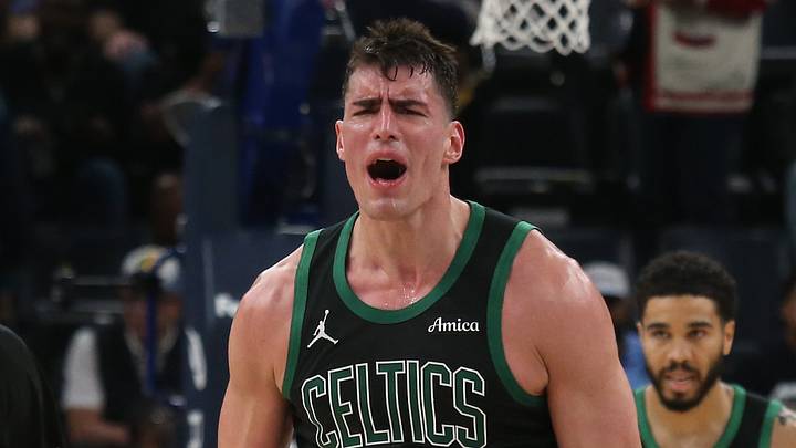 Mar 20, 2026; Memphis, Tennessee, USA; Boston Celtics guard Baylor Scheierman (55) and center Luka Garza (52) react during the fourth quarter against the Memphis Grizzlies at FedExForum. Mandatory Credit: Petre Thomas-Imagn Images