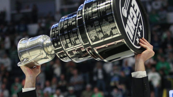 Florida Everblades coach Brad Ralph hoists the Kelly Cup after the Everblades' 4-3 overtime win in game 5 of the ECHL Kelly Cup Finals against the Kansas City Mavericks at Hertz Arena in Estero on June 8, 2024. The Everblades won for the third time in a row.