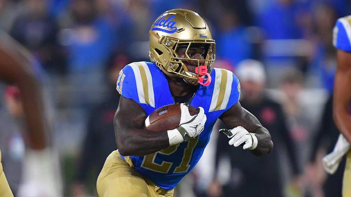 Nov 8, 2025; Pasadena, California, USA; UCLA Bruins running back Jaivian Thomas (21) runs the ball against the Nebraska Cornhuskers during the first half at the Rose Bowl. Mandatory Credit: Gary A. Vasquez-Imagn Images Nov 8, 2025; Pasadena, California, USA; UCLA Bruins running back Jaivian Thomas (21) runs the ball against the Nebraska Cornhuskers during the first half at the Rose Bowl. Mandatory Credit: Gary A. Vasquez-Imagn Images