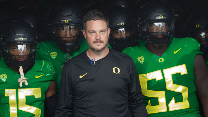 Oregon coach Dan Lanning leads his team onto the field before the game against Colorado in Eugene Saturday, Sept. 23, 2023.