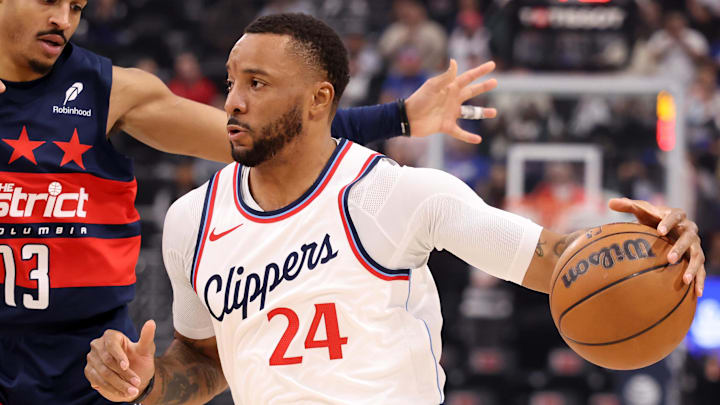 Jan 23, 2025; Inglewood, California, USA; Los Angeles Clippers guard Norman Powell (24) drives against Washington Wizards guard Jordan Poole (13) during the first half at Intuit Dome. Mandatory Credit: Kiyoshi Mio-Imagn Images Jan 23, 2025; Inglewood, California, USA; Los Angeles Clippers guard Norman Powell (24) drives against Washington Wizards guard Jordan Poole (13) during the first half at Intuit Dome. Mandatory Credit: Kiyoshi Mio-Imagn Images