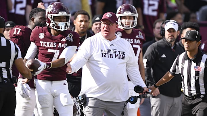 Texas A&M Aggies head coach Mike Elko reacts to a call during the game between the Aggies and the Hurricanes at Kyle Field. 