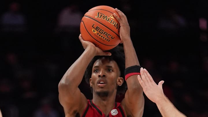 Mar 12, 2026; Charlotte, NC, USA; NC State Wolfpack guard Jr. Paul McNeil (2) shoots the ball against the Virginia Cavaliers during the second half at Spectrum Center. Mandatory Credit: Jim Dedmon-Imagn Images