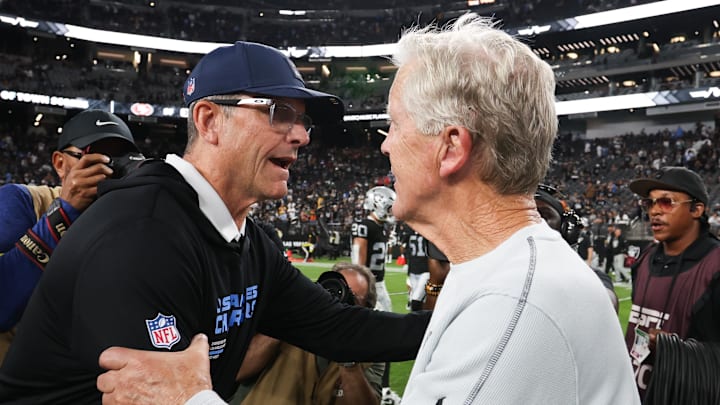 Sep 15, 2025; Paradise, Nevada, USA; Las Vegas Raiders head coach Pete Carroll and Los Angeles Chargers head coach Jim Harbaugh shake hands after the game at Allegiant Stadium. Mandatory Credit: Kiyoshi Mio-Imagn Images