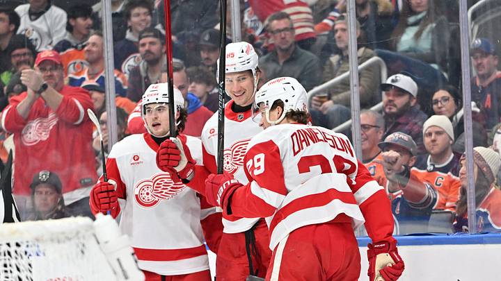 Dec 11, 2025; Edmonton, Alberta, CAN; Detroit Red Wings  center Marco Kasper (92), left winger Elmer Soderblom (85) and center Nate Danielson (29) celebrate a goal on Edmonton Oilers goalie Stuart Skinner (74) during the second period at Rogers Place. Mandatory Credit: Walter Tychnowicz-Imagn Images