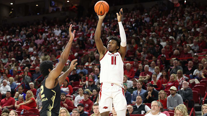 Arkansas Razorbacks forward Karter Knox (11) shoots a three point shot in the first half against the Oakland Golden Grizzlies at Bud Walton Arena. 