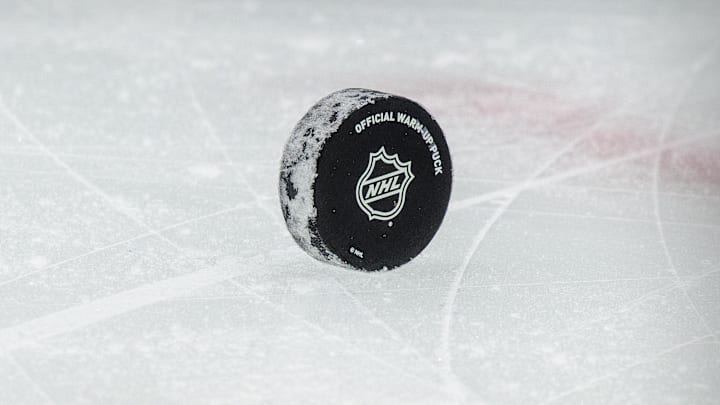 Jan 26, 2021; Dallas, Texas, USA; A view of a puck and the NHL logo and the face-off circle before the game between the Dallas Stars and the Detroit Red Wings at the American Airlines Center. Mandatory Credit: Jerome Miron-Imagn Images