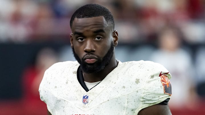 Sep 25, 2025; Glendale, Arizona, USA; Arizona Cardinals running back Trey Benson (33) against the Seattle Seahawks at State Farm Stadium. Mandatory Credit: Mark J. Rebilas-Imagn Images