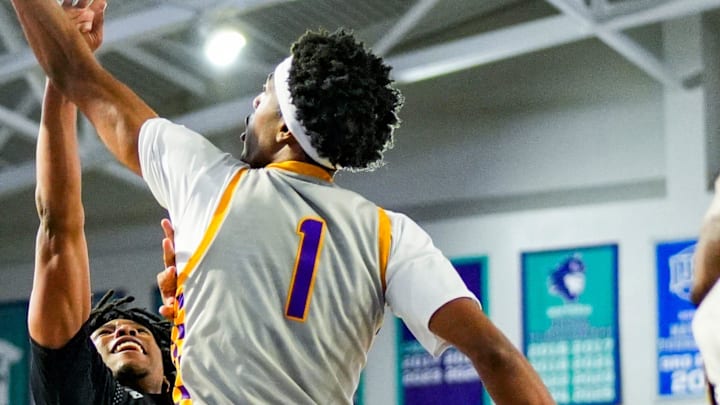 Montverde Academy Eagles forward Joe Philon (1) blocks a shot attempt from Gillion Academy Lions guard Jayden Joseph (1) during the fourth quarter of a City of Palms Classic Signature Series game at Suncoast Credit Union Arena in Fort Myers, Fla., on Friday, Dec. 19, 2025.
