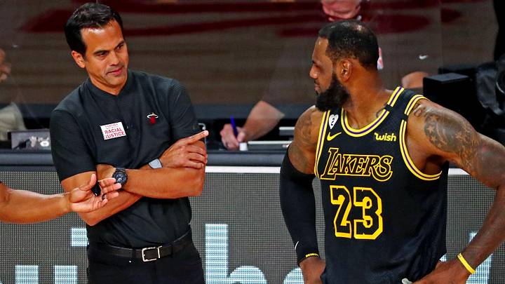 Oct 9, 2020; Lake Buena Vista, Florida, USA; Miami Heat head coach Erik Spoelstra talks with Los Angeles Lakers forward LeBron James (23) during the second quarter in game five of the 2020 NBA Finals at AdventHealth Arena. Mandatory Credit: Kim Klement-Imagn Images
