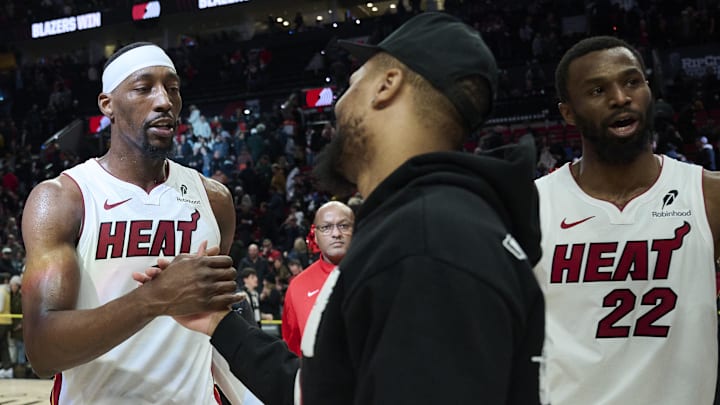 Jan 22, 2026; Portland, Oregon, USA; Miami Heat center Bam Adebayo (13) greets Portland Trail Blazers guard Damian Lillard (0) after a game at Moda Center. Mandatory Credit: Troy Wayrynen-Imagn Images