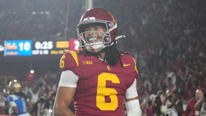 Nov 29, 2025; Los Angeles, California, USA; Southern California Trojans wide receiver Makai Lemon (6) celebrates after catching a 32-yard touchdown pass against the UCLA Bruins in the second half at United Airlines Field at Los Angeles Memorial Coliseum. Mandatory Credit: Kirby Lee-Imagn Images
