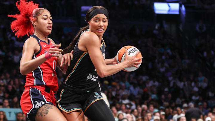 Aug 28, 2025; Brooklyn, New York, USA;  New York Liberty forward Isabelle Harrison (21) looks to post up against Washington Mystics forward Shakira Austin (0) in the third quarter at Barclays Center. Mandatory Credit: Wendell Cruz-Imagn Images