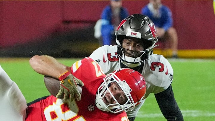 Kansas City Chiefs tight end Travis Kelce (87) runs the ball and is tackled by Tampa Bay Buccaneers safety Jordan Whitehead (3).