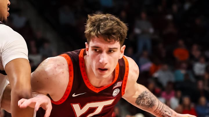 Dec 2, 2025; Columbia, South Carolina, USA; Virginia Tech Hokies guard Neoklis Avdalas (17) drives around South Carolina Gamecocks forward Elijah Strong (31) in the second half at Colonial Life Arena. Mandatory Credit: Jeff Blake-Imagn Images