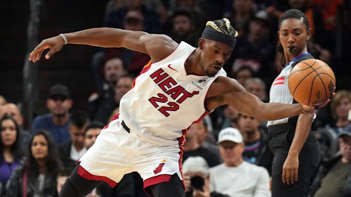 Nov 6, 2024; Phoenix, Arizona, USA; Miami Heat forward Jimmy Butler (22) saves the ball against the Phoenix Suns during the first half at Footprint Center. Mandatory Credit: Joe Camporeale-Imagn Images