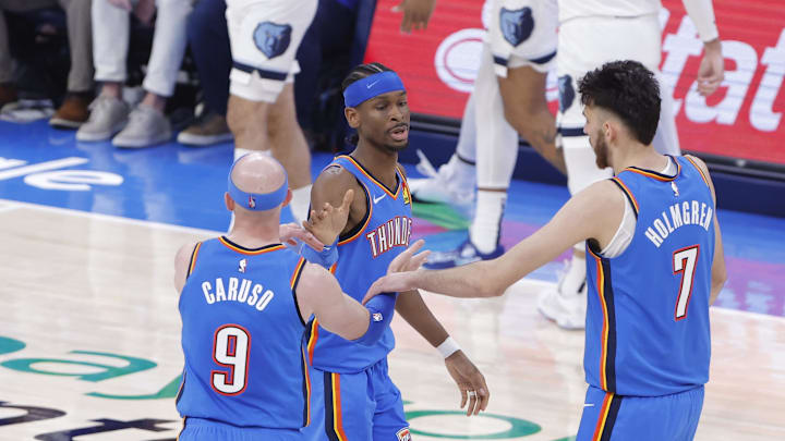 Apr 22, 2025; Oklahoma City, Oklahoma, USA; Oklahoma City Thunder guard Shai Gilgeous-Alexander (2), guard Alex Caruso (9) and forward Chet Holmgren (7) celebrate after a play against the Memphis Grizzlies in the second quarter during game two of first round for the 2024 NBA Playoffs at Paycom Center. Mandatory Credit: Alonzo Adams-Imagn Images Apr 22, 2025; Oklahoma City, Oklahoma, USA; Oklahoma City Thunder guard Shai Gilgeous-Alexander (2), guard Alex Caruso (9) and forward Chet Holmgren (7) celebrate after a play against the Memphis Grizzlies in the second quarter during game two of first round for the 2024 NBA Playoffs at Paycom Center. Mandatory Credit: Alonzo Adams-Imagn Images
