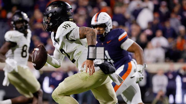 Nov 8, 2025; Charlottesville, Virginia, USA; Wake Forest Demon Deacons quarterback Robby Ashford (2) runs with the ball against the Virginia Cavaliers during the second half at Scott Stadium. Mandatory Credit: Amber Searls-Imagn Images Nov 8, 2025; Charlottesville, Virginia, USA; Wake Forest Demon Deacons quarterback Robby Ashford (2) runs with the ball against the Virginia Cavaliers during the second half at Scott Stadium. Mandatory Credit: Amber Searls-Imagn Images